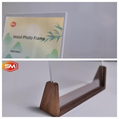 China Ecofriendly Top Loading Clear Acrylic Photo Display Frame With Customized Wooden Base for sale