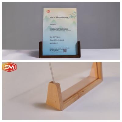 China A4 Clear Desktop Clear Acrylic Photo Frame with Wood Base for sale