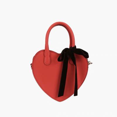 China Retro fashion bag 2020 body shoulder crowd design heart bag a small female insta cross female super hot net new celebrity for sale