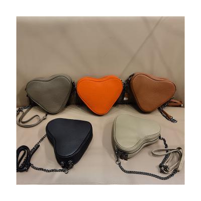 China Urban Wholesale Adjustable Length Strap Leisure Solid Color Cute Heart Shaped Messenger Messenger Bag for sale