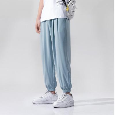 China Anti-wrinkle Summer Sports Tracksuit Light Blue Harem Pants Wholesale Streetwear Pants Logo For Men Custom Made for sale