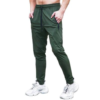 China Anti-wrinkle men's lightweight tracksuit bottoms elastic sports pants gym running joggers slim fit trousers for sale