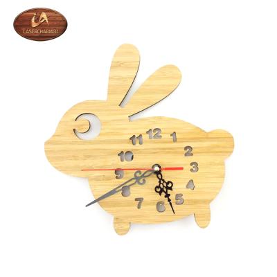 China Europe's simple brief and in tasteful rabbit shape quiet wooden wall clock for sale