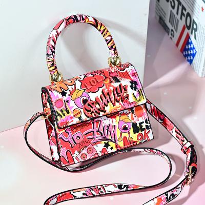 China 2021 PVC Designer Brand Kid's Small Mini Cute Mini Purse Bags & Purses Graffiti Purses for sale