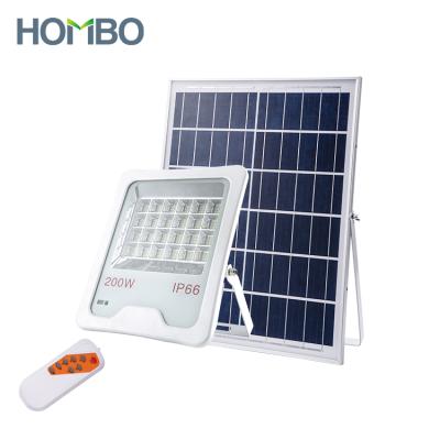 China Aluminum Warehouse HOMBO Ip66 50W 100W 200W Automatic Waterproof Remote Control Outdoor Solar Flood Light for sale