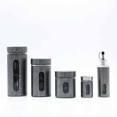 China Viable Black Metal Clad Food and Spice Shaker Oil Vinegar Bottle Glass Storage Jar and Salt Pepper Shaker for sale