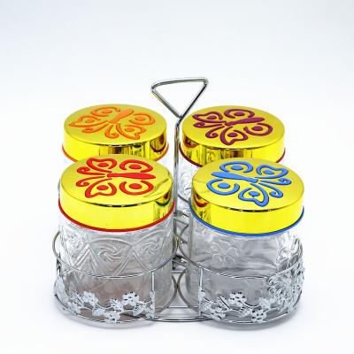 China Viable Set 4 Storage Clear Glass Jars With Screw Plastic Lid In Metal Rack Clear Glass Cookie Jars for sale