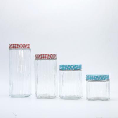 China Sustainable 4 Piece Clear Storage Glass Jars With Custom Printed Metal Screw Lid for sale