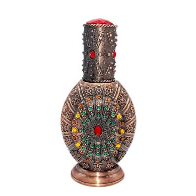 China Flat metal plated alloy Arabic perfume bottle Middle East Dubai luxury art design packaging bottle for sale