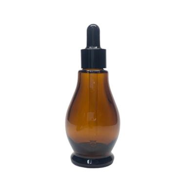 China 30ml amber bottle of fine oil Serum dropper glass bottle spherical shape empty bottle for sale