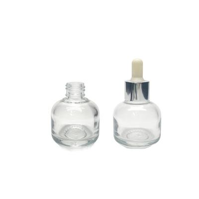 China Small size cosmetics in round glass bottles essential oil, milk and serum containers for sale