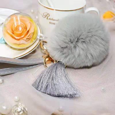 China Fresh roses touch holding self-defense key chain 2019 hot sale 5cm plastic ball with preserved wool rose flowers key chain for valentines days for sale