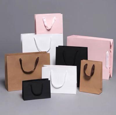 China Personality Recyclable Custom Printed Black Luxury Brand Clothing Retail Packaging Paper Bag With Logo for sale