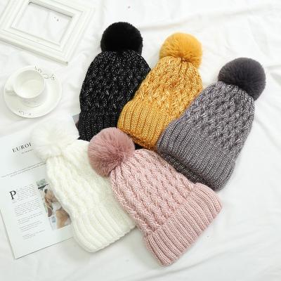 China Wholesale Casual With Shine Beanie Manufacturer Beanies Winter Knitted Faux Fur Ball Pom Pom Hats With Custom Logo for sale