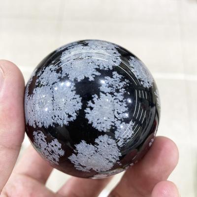 China China Wholesale Natural White Ball Polished Snowflake Stone Sphere Crystal Ball Healing Black And for sale