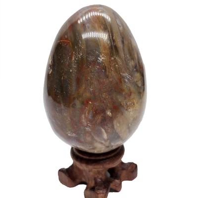 China China Wholesale Natural Healing Crystal Wooden Fossil Egg Colored Crystal Polishing Crystal Palm For Decoration for sale