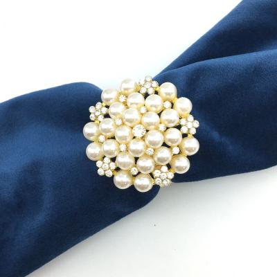 China Viable Wholesale Rhinestone Pearl Napkin Ring Wedding Hotel Napkin Button Holder for sale