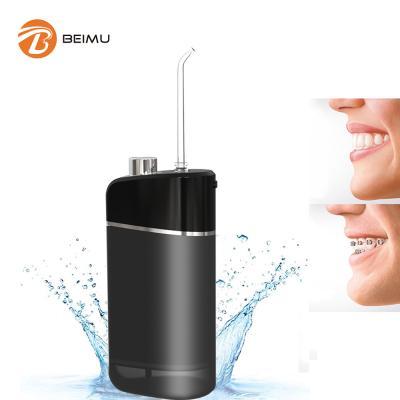 China Portable Handheld Brush Water Flosser Oral Irrigator Irrigator Pick Serve Clean Tooth Cordless Rechargeable Teeth Cleaner for sale