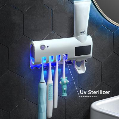 China Durable Toothpaste Dispenser Toothbrush Holder Wall Mount Holder Dustproof Bathroom Accessories Set Toothpaste Squeezer Tooth for sale