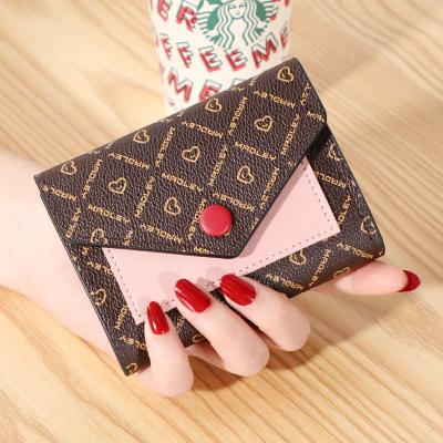 China 2021 new European and American fashion wallet buckle mobile phone bag waterproof female mid length multifunctional bags for sale