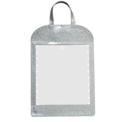 China New Design PU Leather Lighted Hanging Make Up Mirror With Handle Sensor Switch Smart Vanity Mirror With LED Lights for sale