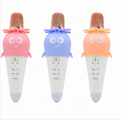 China Sing Songs Cute K5 Carrot Shape Karaoke Blue Orange Tooth Microphone Blue Pink Usb For Kids Kid Family Singing Wireless Handheld Speaker for sale