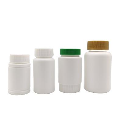 China Low Price Medicine Custom Vertical Striped White Capsule Pill Colorful Lids Bottle for sale