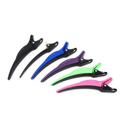 China Cutey Heat Resistant Hair Sectioning Clip With Teeth ABS Barber Clip Hair Clip Usable Dolphin Shape Hair Beauty Clip for sale