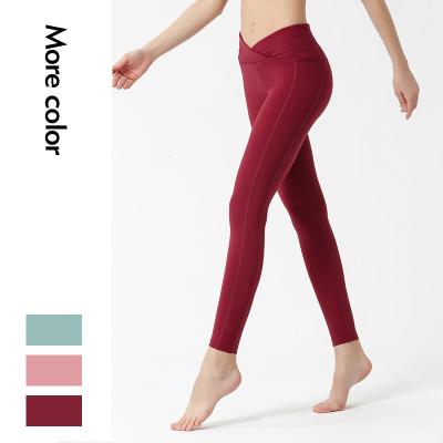 China New Solid Color Antibacterial Tight High Waist Sports Yoga Pants Women's Outdoor Quick Dry Fitness Yoga Pants High Waist And Hip Lifting Pan for sale