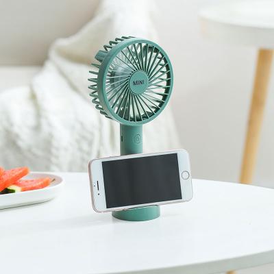 China Factory Wholesale Easy Carry 5V Macaron Color Usb Rechargeable Portable Handheld Fan Mini Air Cooling Fan Table with Phone Holder for sale