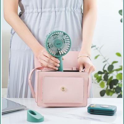 China Easy Color 5V Rechargeable Handheld Fan Mini Air Cooling Fan Portable Carry Table Usb Macaron Fan With Phone Holder for sale