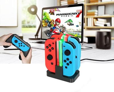 Cina stazione di carico 4 del commutatore di Nintendo di U-modo/Lite del commutatore in 1 caricatore di Joycon del supporto del bacino di viaggio in vendita