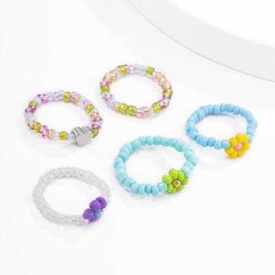 China BOHEMIA 5pcs Set Handmade Daisy Flower Beads Rings Jewelry Women Girls Beaded Plastic Rings Trendy Gifts 2022 for sale