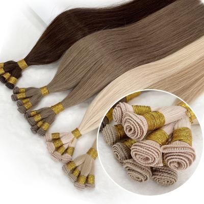 China Indian Remy Human Hair Russian Blonde Hand Tied Natural Weft Hand Drawn Qingdao Virgin Ombre 12y 100 Pure Virgin Human Hair Double Tied Hair Extensions for sale