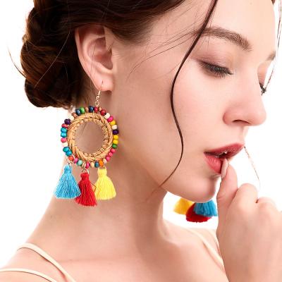 China CLASSIC Bohemia Rattan Circle Fashion Rice Bead Tassel Wooden Woven Colorful Earrings for sale