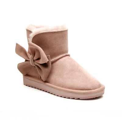 China 2021 New Design Anti-Smell Big Bowknot Sheep Fur Anti-skid Flats Warm Winter Genuine Leather Waterproof Women Snow Boots for sale