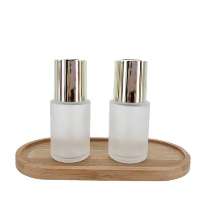 China 30ml Wholesale Cosmetics Cosmetics Packaging Skin Care Button Dropper Bottle Essential Oil Glass Bottle for sale