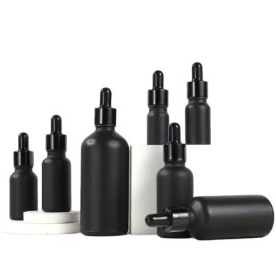 China Luxury Cosmetic Packaging Black Cosmetic Packaging 100ml Skin Care Dropper Essential Oil Glass Bottle for sale