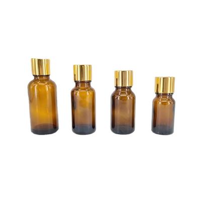 China Personal Care 5ml 10ml 20ml 30ml 50ml 100ml Gold Lid Round Dropper Vial Essential Oil Glass Bottle With Plug for sale