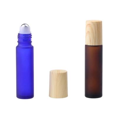 China Minimalist Style 5ml 10ml Frosted Roller Bamboo Glass Bottle With Lid Cap Bamboo Top Perfume Bottle for sale