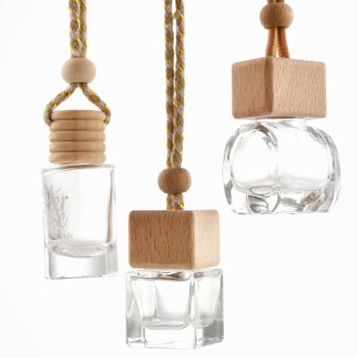 China Car Wooden Empty Glass Air Freshener Daily Life Cap Perfume Bottle Hanging Diffuser Bottle for sale