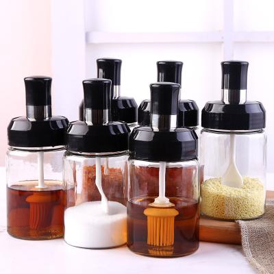 China Viable Household Sealed Set Herb Spice Oil Storage Brush Honey Stick Cap Spice Glass Bottles Jar With Spoon for sale