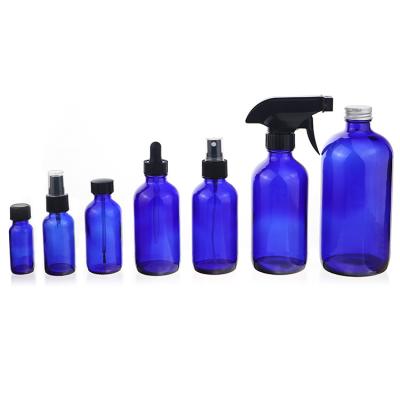 China 10/15/20/30/50/100/500ml Perfume Cosmetic Luxury Blue Glass Spray / Dropper / Pump Bottles Essential Oil Sprayer Set for sale