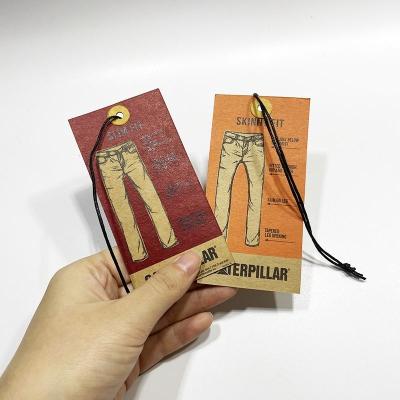 China Environmentally Friendly High Quality Wholesale Custom Kraft Paper Labels Safety Pins Wax String Leather Jeans Screen Printed Hang Tags for sale