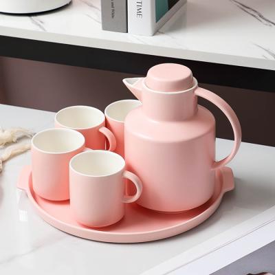 China Modern Nordic style drinkware pink color matte 4 cups round tray porcelain teacup sets tea set with teapot for sale