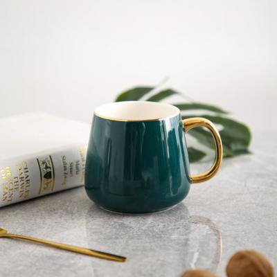 China Sustainable Items Like Customized Golden Jasper Green Handle Coffee Tea Mug Porcelain for sale