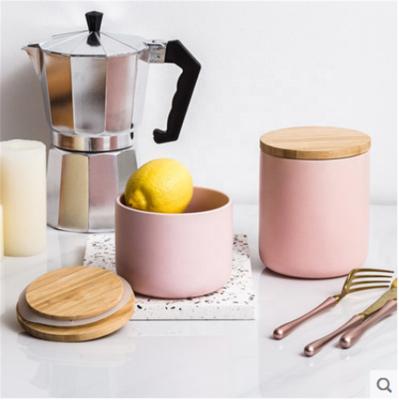 China Cheap Viable Porcelain Coffee Kitchen Ware Pink Glaze Airtight Canister With Wooden Lid for sale