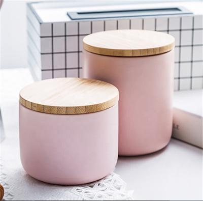 China Sustainable High Quality Porcelain Air Tight Pink Storage Jars With Wooden Lids for sale