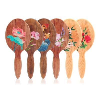 China For Home Use Baihe Three-dimensional Flower Printed Artificial Wood Printing Plastic Material Round Hair Brush for sale