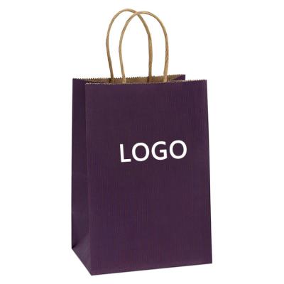 China Recycled materials wholesale grocery kraft paper gift bag with handle clothing store bag with customization logo for sale